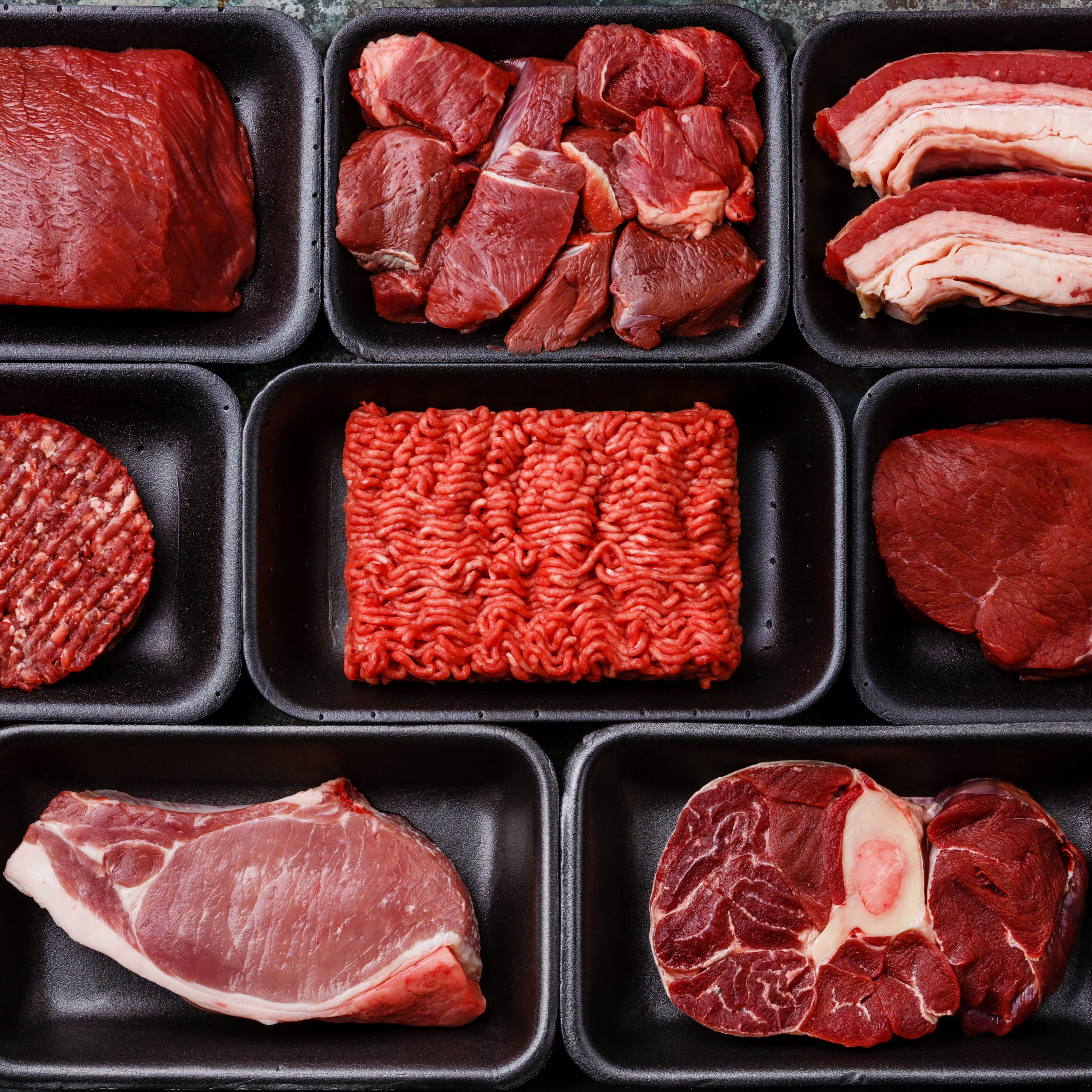 Different types of meat in trays