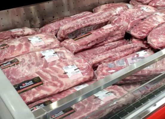 Packaged meat is in a refrigerator